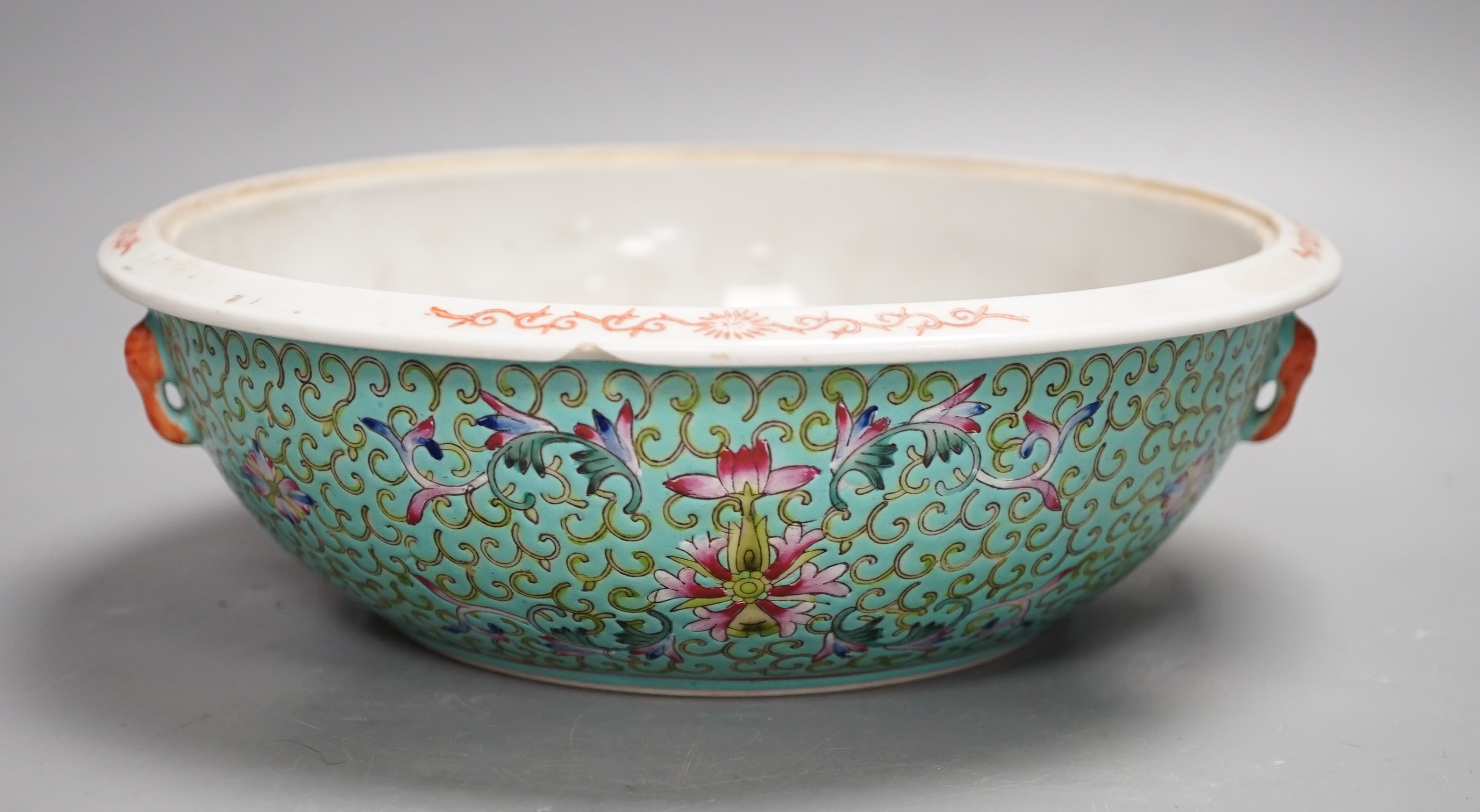 A 20th century Chinese famille rose turquoise ground floral bowl. 23.5cm diameter, lacking cover